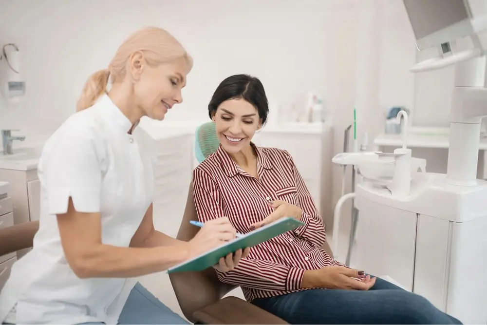 patient telling her orthodontist information about herself - Best Orthodontist Near Me: How to Actually Evaluate One in Austin | Limestone Hills Orthodontics Austin TX