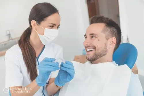a woman and a man smiling Suresmile vs Invisalign