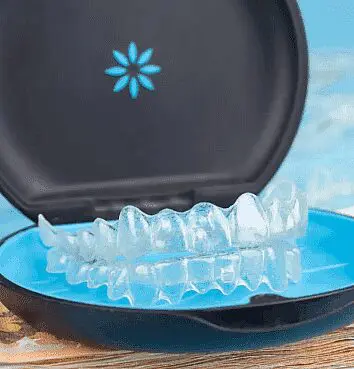 A set of clear Invisalign aligners rests in their blue and black case. Limestone Hills Orthodontics in Austin, TX, offers Invisalign treatments.