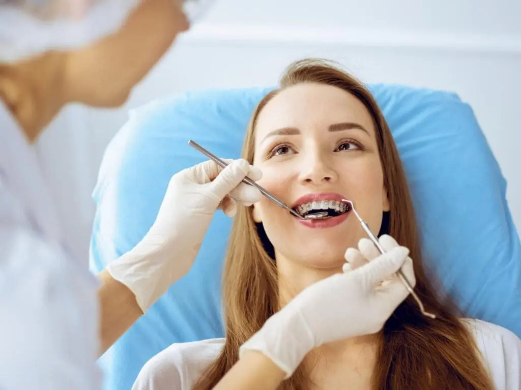 A young woman gets Teeth Gaps, Spacing Treatment, and Accelerated Orthodontic Treatment with braces at Limestone Hills Orthodontics in Austin, TX.