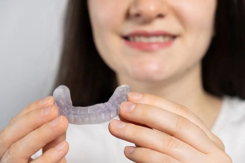 At Limestone Hills Orthodontics in Austin, TX, a person represents Preventing Orthodontic Emergencies with TMJ Mouthguard for sports.