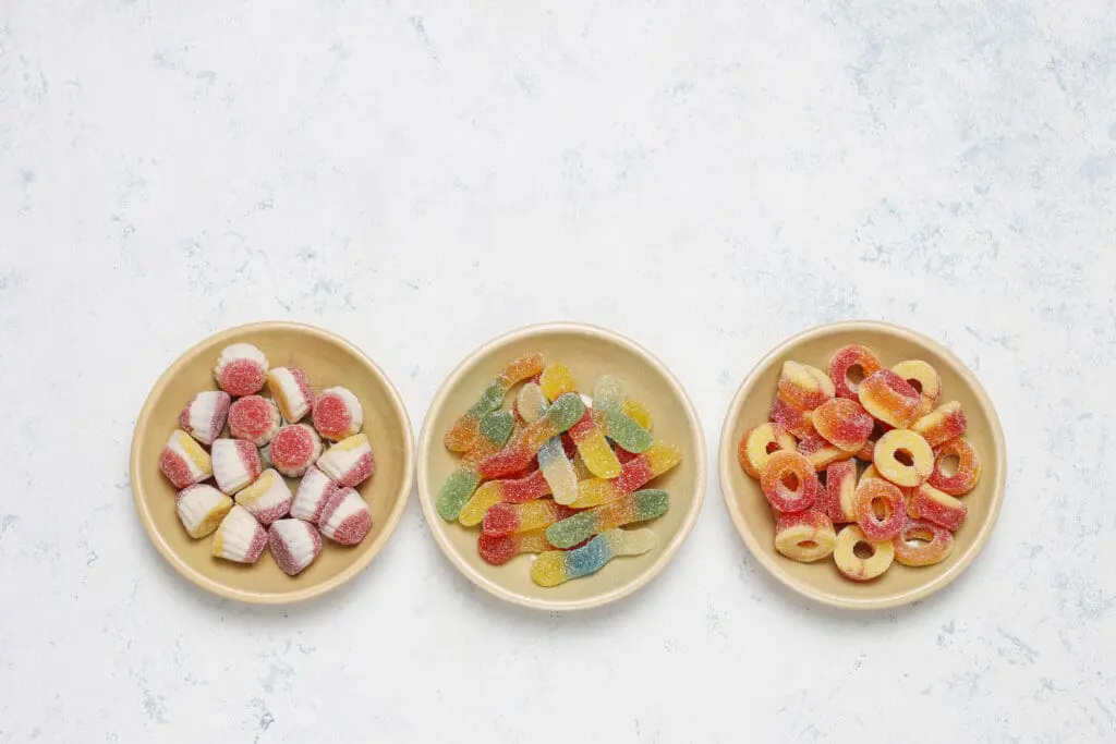 colorful candies jelly marshmallow light surface top view with copy space - Foods to Avoid with Braces: A Practical Family Guide