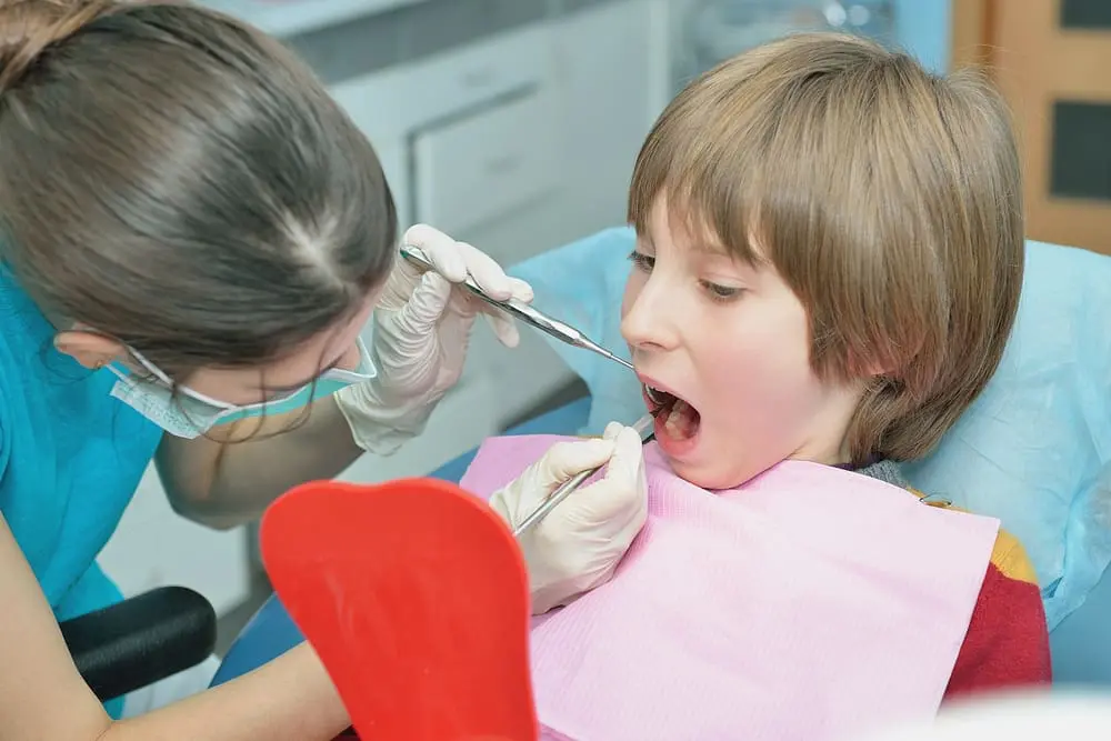 dentist curing child patient - Phase 1 vs Phase 2 Orthodontics: A Parent Guide | Limestone Hills Orthodontics Austin TX
