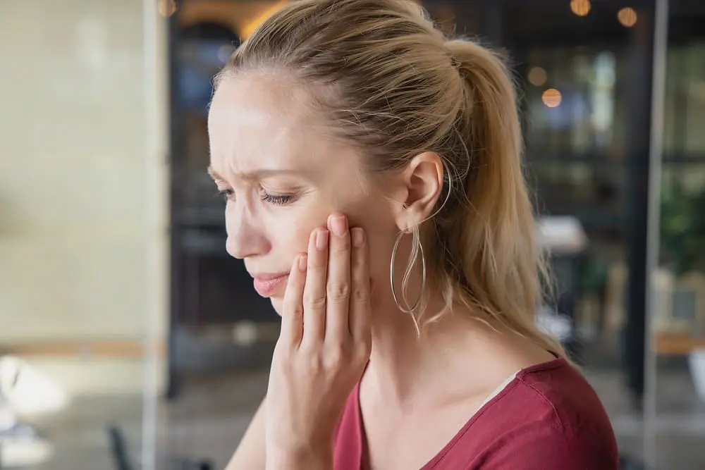 woman toothache sick caucasian woman suffering toothache tooth decay tooth - Root Resorption and Braces: Risks and How Limestone Hills Prevents It | Limestone Hills Orthodontics Austin TX