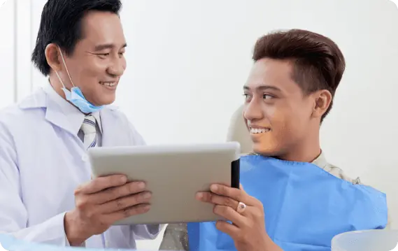 Orthodontist explaining the Benefits of Jaw Surgery to a young patient and parent during a consultation at Limestone Hills Orthodontics in Austin, TX. Orthodontist explaining the Benefits of Jaw Surgery to a young patient and parent during a consultation at Limestone Hills Orthodontics in Austin, TX.